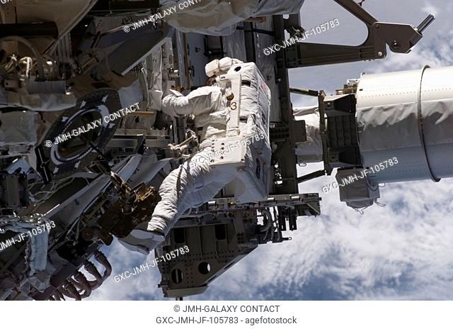 Astronaut Heidemarie M. Stefanyshyn-Piper, STS-115 mission specialist, works near the Solar Alpha Rotary Joint (SARJ) during the Sept