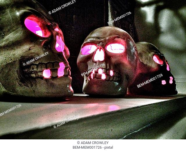 Close up of illuminated metal skulls