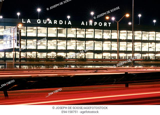 Parking garage and blurry car lights at La Guardia Airport. New York City. USA