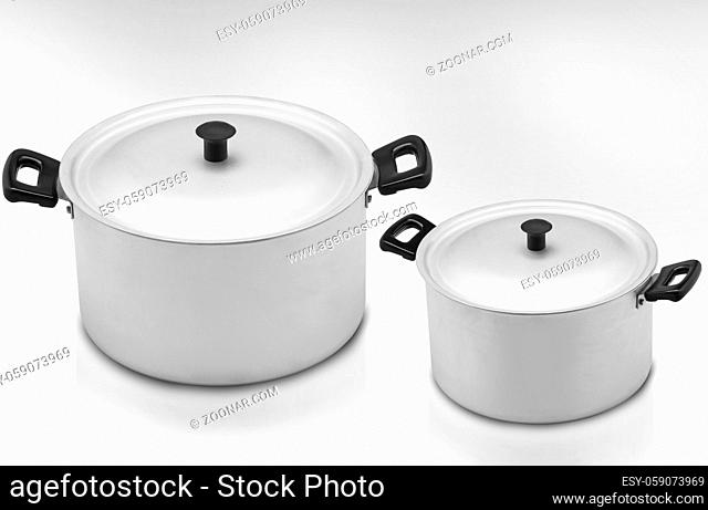 several cooking pots on a light background