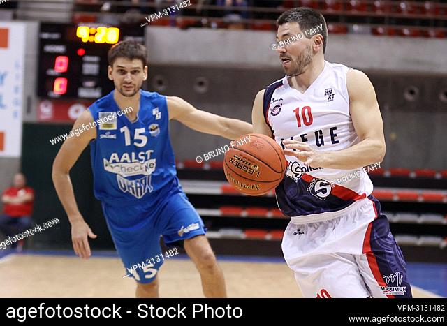 Liege's Milos Bojovic and Liege's Maxime Depuydt fight for the ball during the basketball match between Liege Basket and Okapi Aalst
