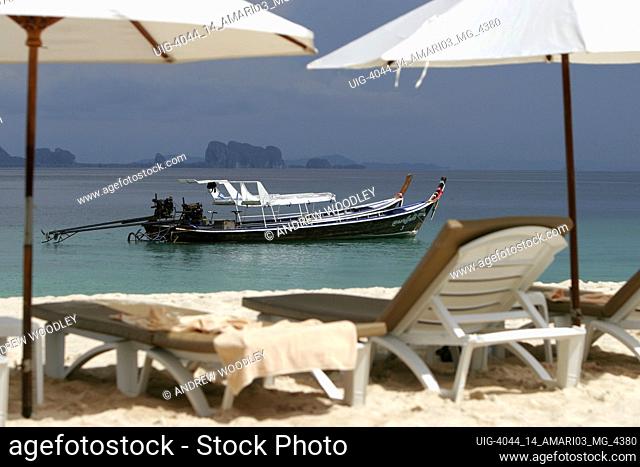 Beach umbrellas and sun loungers Amari Resort beach club Ko Kradan island Thailand