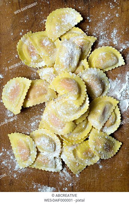 Uncooked homemade ravioli filled with salmon