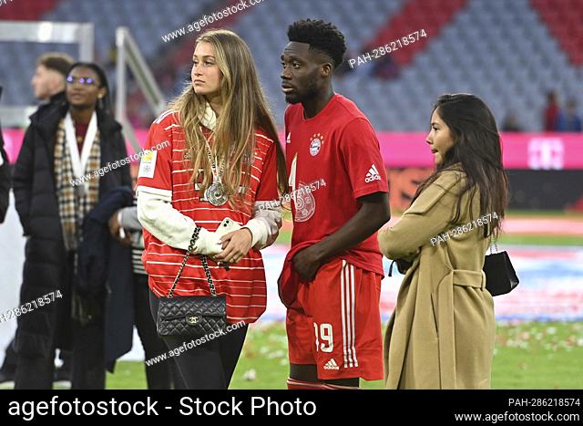 Alphonso DAVIES (FC Bayern Munich) with girlfriend Jordyn HUITEMA after award ceremony, football 1. Bundesliga season 2021/2022, matchday 33, matchday33