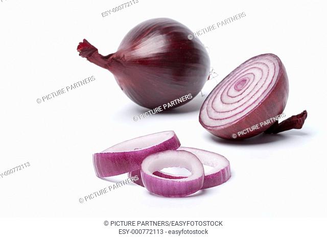 One red onion, half and rings on white background