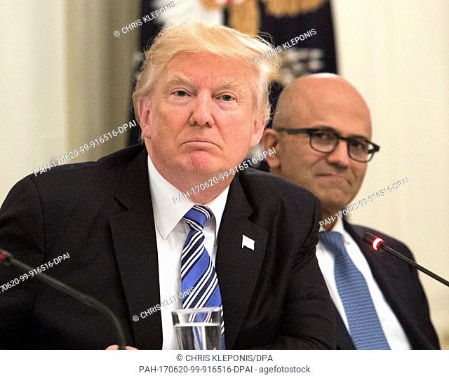 United States President Donald J. Trump (L) participates in an American Technology Council roundtable with corporate and eduction leaders including Microsoft...