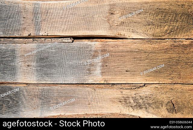 Close up background texture of old vintage rustic weathered wooden panel with horizontal planks