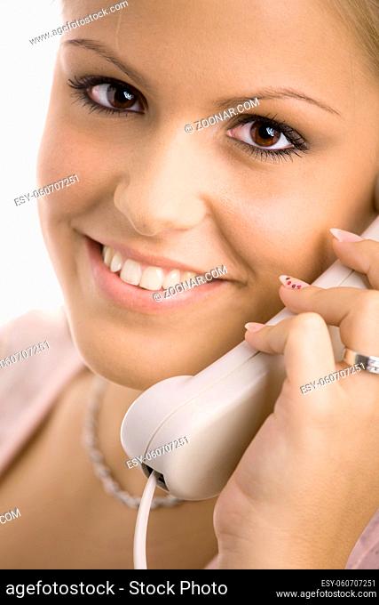 Happy young customer service girl calling on phone smiling