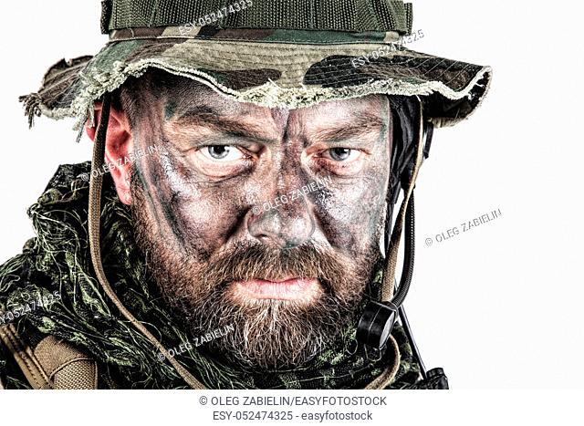 Special forces United States in Camouflage Uniforms studio shot. Wearing jungle hat, Shemagh scarf, painted face. Studio shot isolated