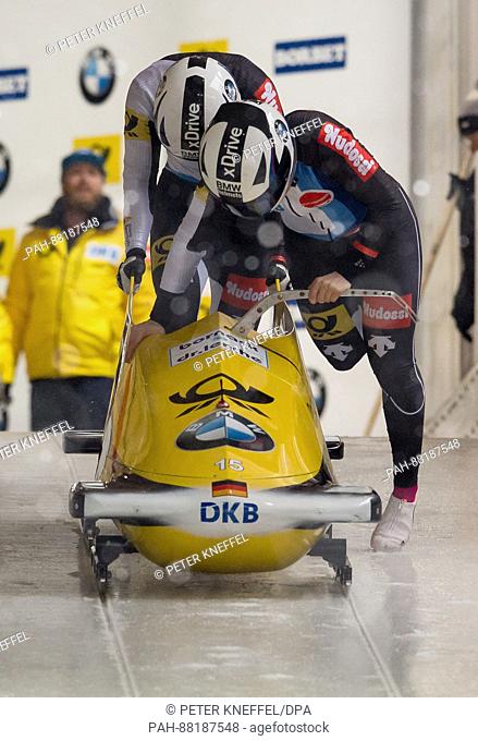 The German bobsleigh team with Stephanie Schneider (front) and Lisa Maria Buckwitz in action during the 1st two-women run of the FIBT World Championship 2017 in...