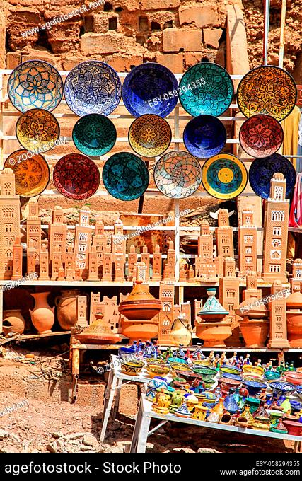 Beautiful arabic colorful hand made pottery bowls on display in the market in Morocco