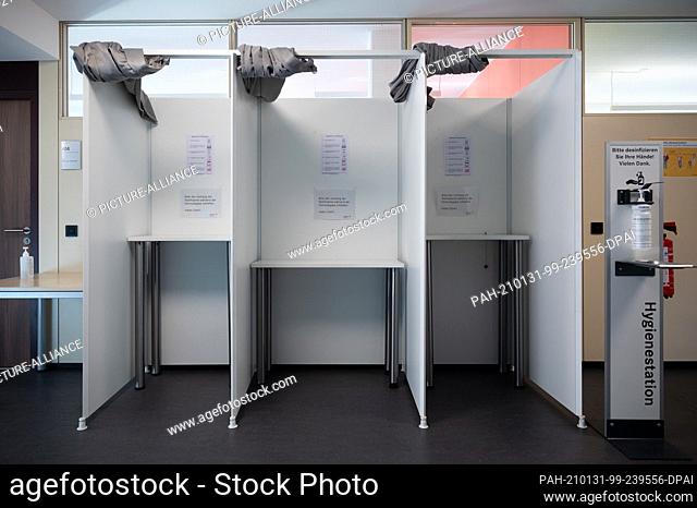 29 January 2021, Baden-Wuerttemberg, Stuttgart: Voting booths for filling out and handing in absentee ballots are located in the town hall