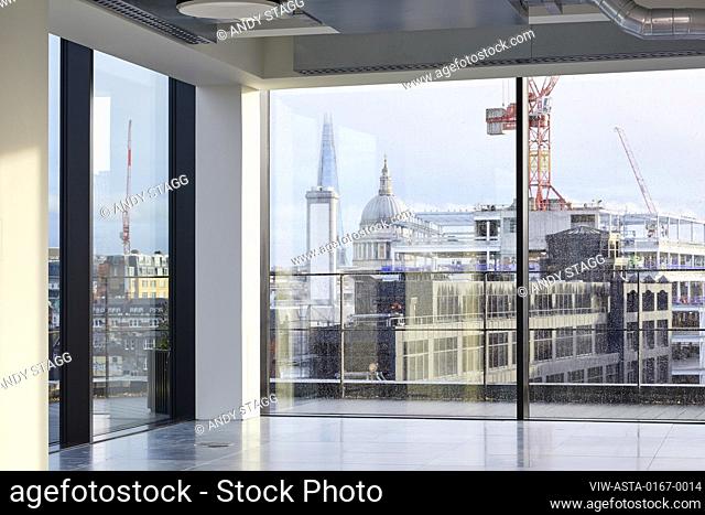 Looking out of the upper floor windows towards the city. 75 Farringdon Road, London, United Kingdom. Architect: Buckley Grey Yoeman, 2019