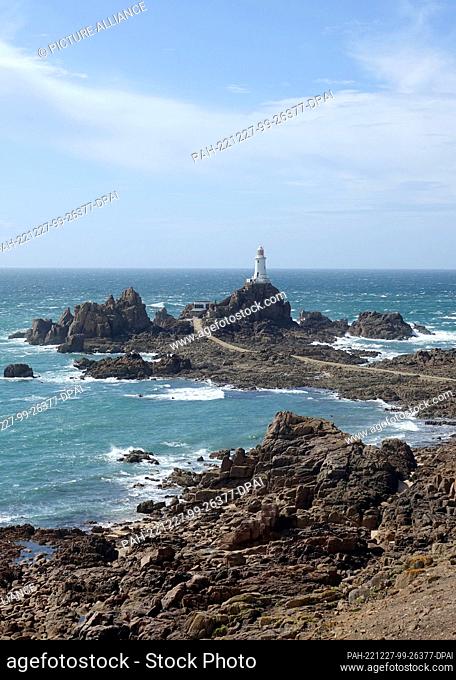 08 September 2022, ---, Jersey: The lighthouse of La Corbiere can be seen at low tide. It is one of the most important landmarks of the Channel Island of Jersey