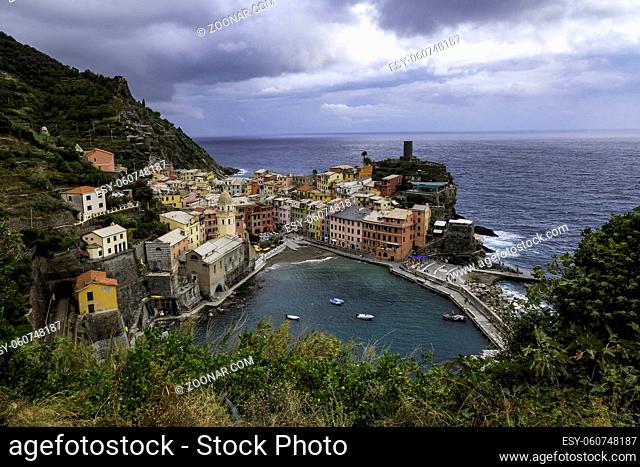 Classic Postcard Aerial View of Vernazza, Cinque Terre, Italy - Colorful Houses and a Beautiful Natural Harbor with Bright Blue Water