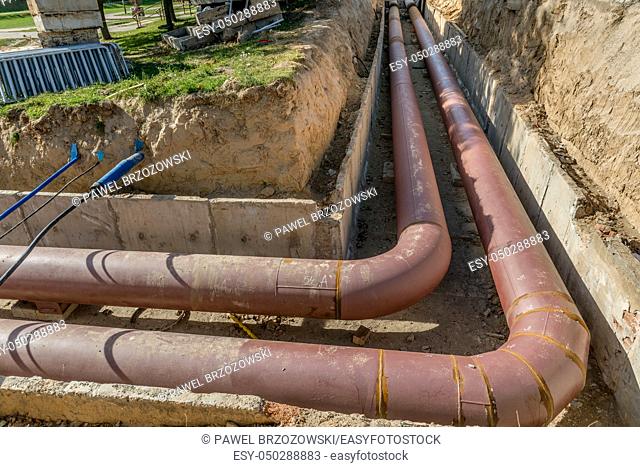 Underground pipe installation. Steel, giant. Laying or replacement of underground pipes. Installation of underground pipes. Utility infrastructure