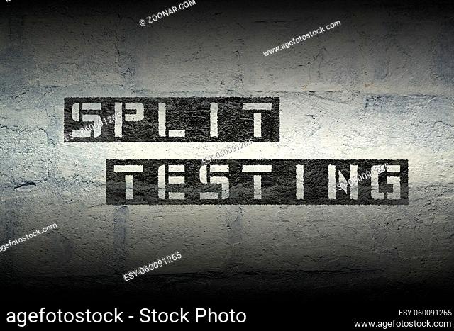 split testing stencil print on the grunge white brick wall
