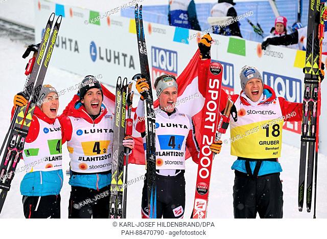 (l-r) Mario Seidl, Philipp Orter, Paul Gerstgraser Bernhard Gruber from Austria celebrate after the men's team combination normal hill/4x5 km event at the...