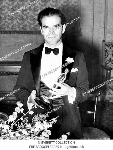 1934: FRANK CAPRA [Best Director, IT HAPPENED ONE NIGHT] holds his Oscar, 3/1/35