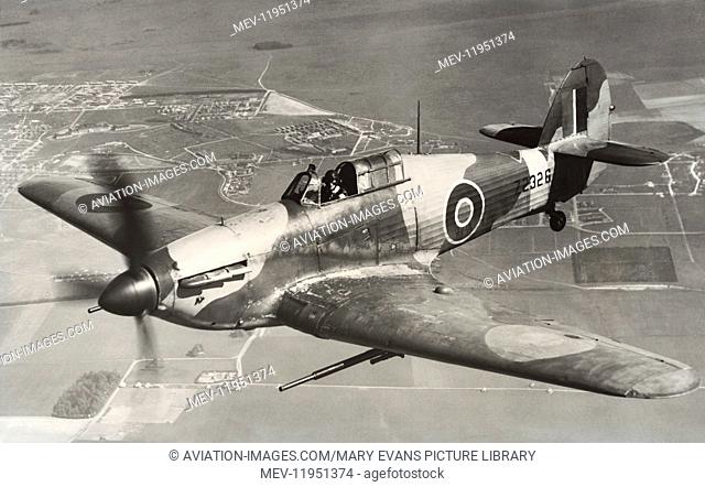 A Royal Airforce RAF Hawker Hurricane Mk 2D with 40Mm Vickers Anti-Tank Cannon Flying Enroute over Fields and Trees