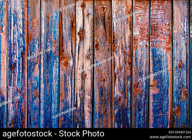 Wood texture background, washed color wood planks half with spots of peeling blue paint. Grunge wood wall pattern