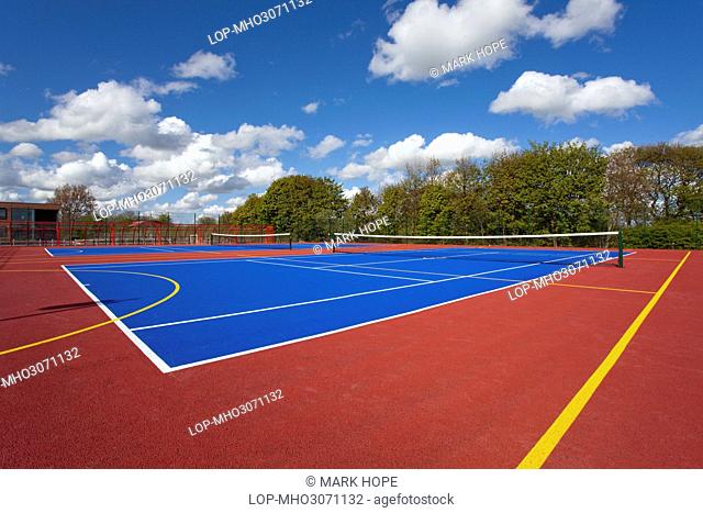 England, County Durham, Durham. Brightly coloured tennis courts at Durham Johnston School