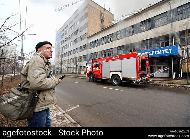 RUSSIA, DONETSK - DECEMBER 21, 2023: A security guard stands by as firefighters respond to a fire at Building 3 of the Donetsk National Technical University...