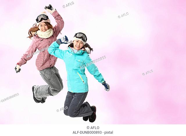 Young Japanese women in snowboard clothes