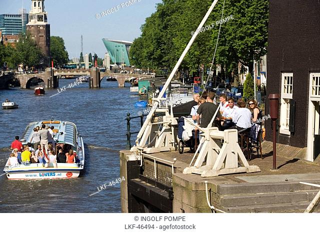 De Sluyswacht, Oude Schans, Boat, View from de Sluyswacht, a typical brown cafe, over Oude Schans to Montelbaanstoren watch tower, and NEMO Museum, Amsterdam