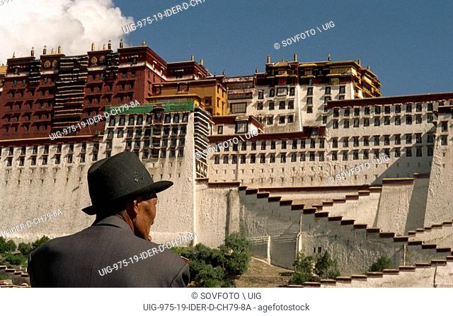 Tibetan man standing in front of Potala Palace, Lhasa, Tibet, China, August 2004
