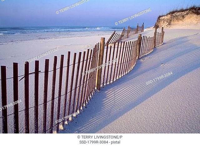 Fence on the beach, Gulf Islands National Seashore, Florida, USA