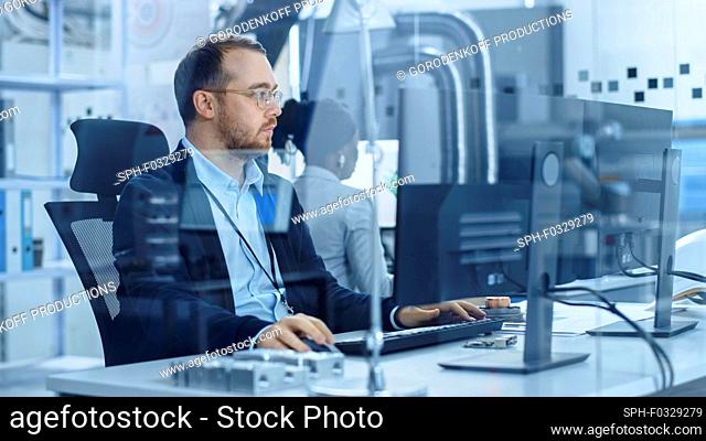 Industrial engineer using a computer