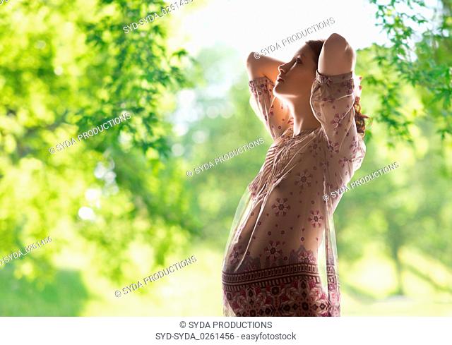 pregnant woman over green natural background