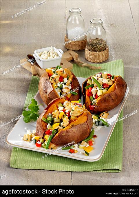 Baked sweet potatoes filled with chicken breast and feta cheese
