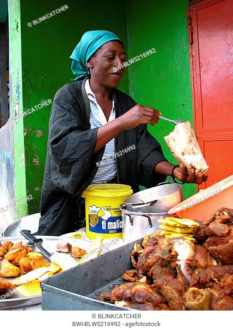 Woman selling fried pork meat at a vending stand, Haiti, Province de l'Ouest, Kenskoff, Port-Au-Prince