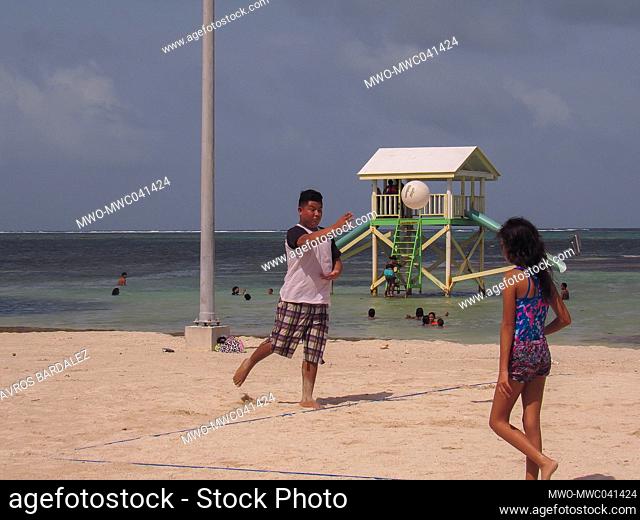 A friendly game of volleyball along the beach of Ambergris Caye, Belize