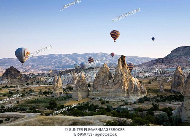 Hot-air balloons above Cappadocia, Central Anatolia, Turkey, Asia