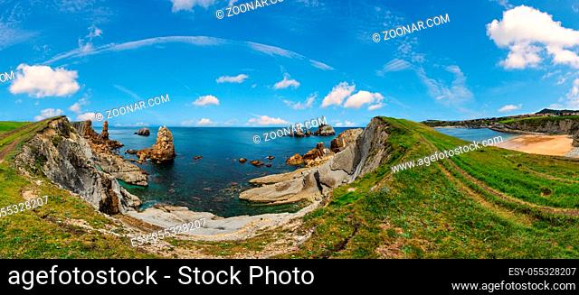 Arnia Beach (Spain) and summer Atlantic Ocean coastline landscape. Six shots stitch high-resolution panorama