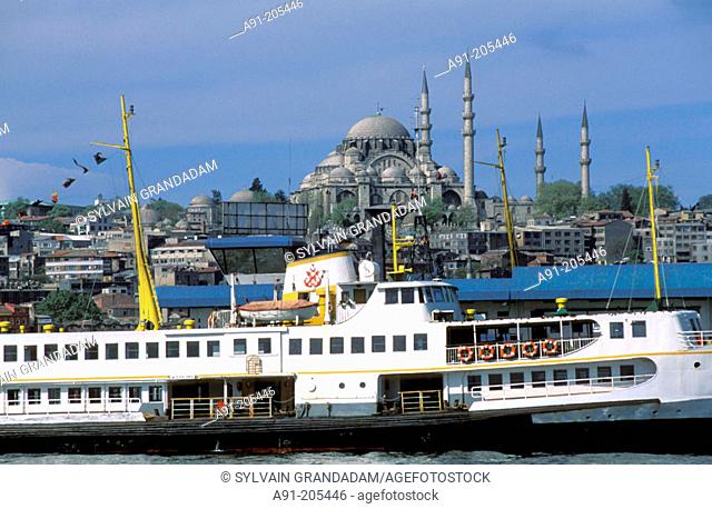 Ferries pier and Suleimaniye mosque in background. Istanbul. Turkey