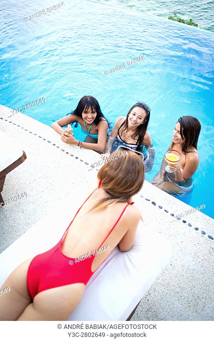 Infinity pool party with four young attractive women, Puerto Vallarta, Mexico