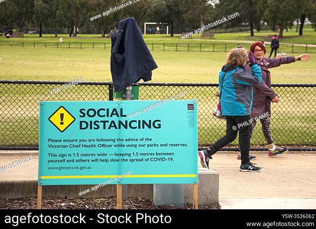 Local government notice in a suburban park promotes social distancing during the COVID-19 pandemic, Melbourne, Australia