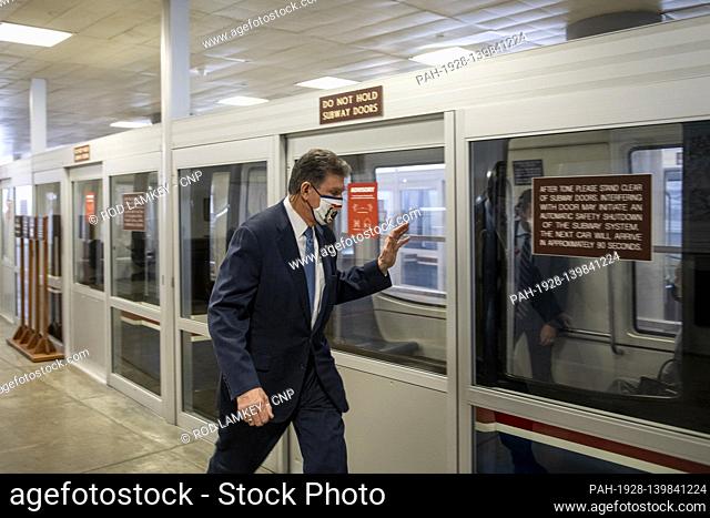 United States Senator Joe Manchin III (Democrat of West Virginia) acknowledges a fellow Senator on the Dirksen Senate Office Building Senate subway platform...