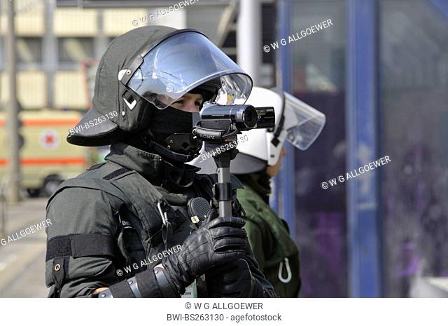 policeman shooting police operation at NPD deployment with video camera, Germany, Baden-Wuerttemberg