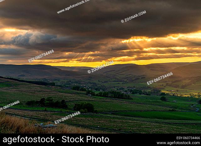 A cloudy sunset in the Yorkshire Dales near Countersett, North Yorkshire, England, UK