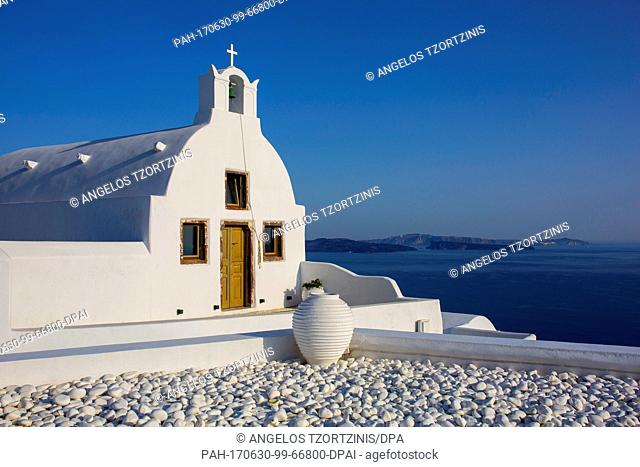 Picture of a chapel in Oia in the island of Santorini, Greece, taken 29 June 2017. A heat wave with temperatures of up to 43 degrees Celsius has hit Greece