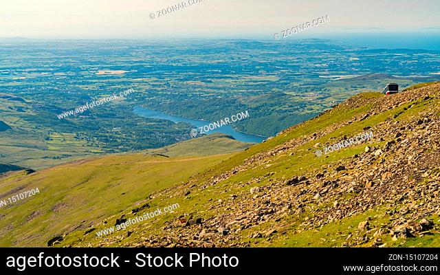 View from Mount Snowdon, Snowdonia, Gwynedd, Wales, UK - looking north towards Llyn Padarn and Llanberis, with the Snowdon Mountain Railway