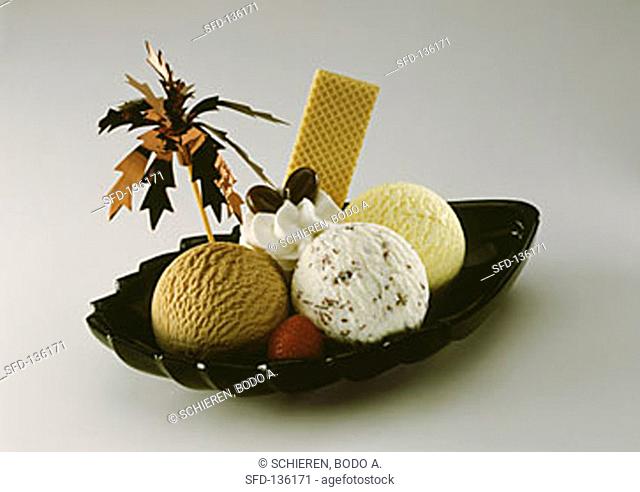 Three scoops of ice cream (mocha, stracciatella, banana)