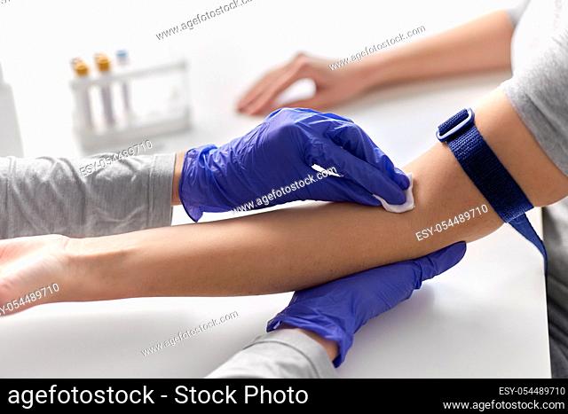 doctor and patient preparing for blood test