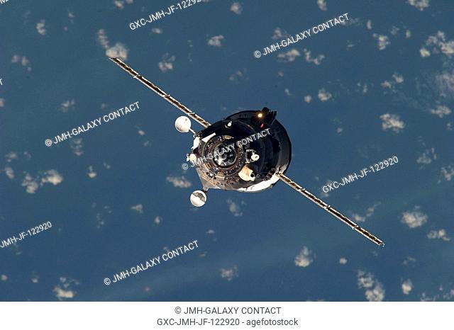 An unpiloted ISS Progress resupply vehicle approaches the International Space Station, bringing 2.6 tons of food, fuel, oxygen