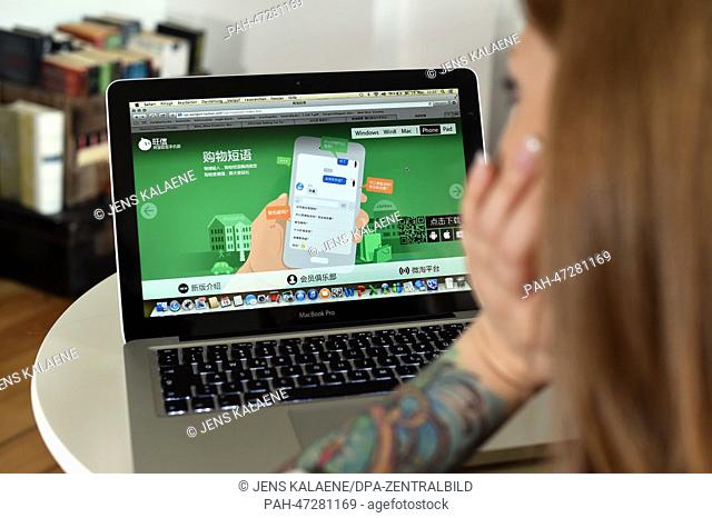 ILLUSTRATION - A young woman browses on her notebook computer through the web page of Chinese online auction platform Taobao looking at online advertisement in...